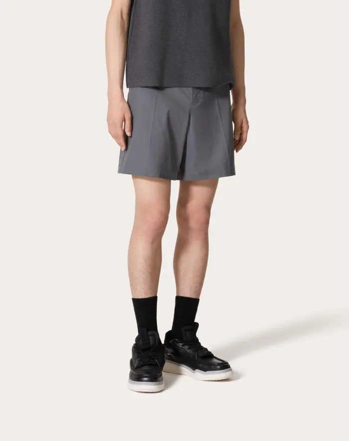Valentino Pants And Shorts Man Stretch Cotton Canvas Bermuda Shorts With Rubberized V Detail For Man In Light Grey Light Grey Valentino Pants And Shorts Man Stretch Cotton Canvas Bermuda Shorts With Rubberized V Detail For Man In Light Grey Light Grey